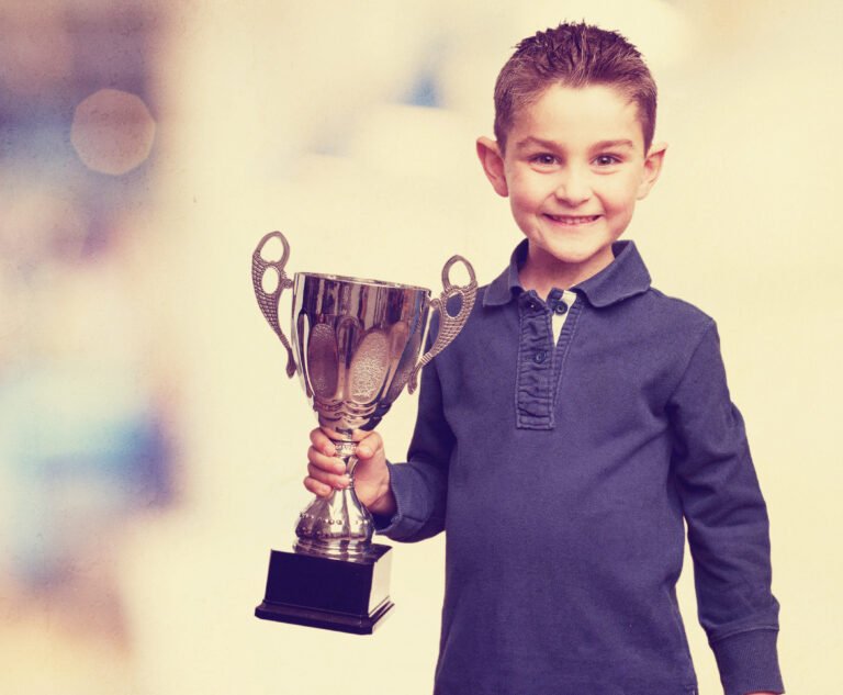 little kid with a trophy